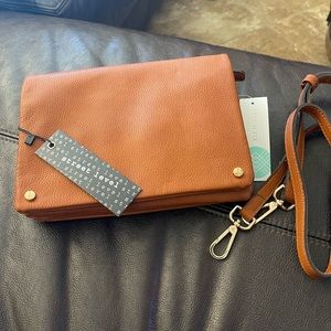Brand new Street Level crossbody/clutch with detachable strap